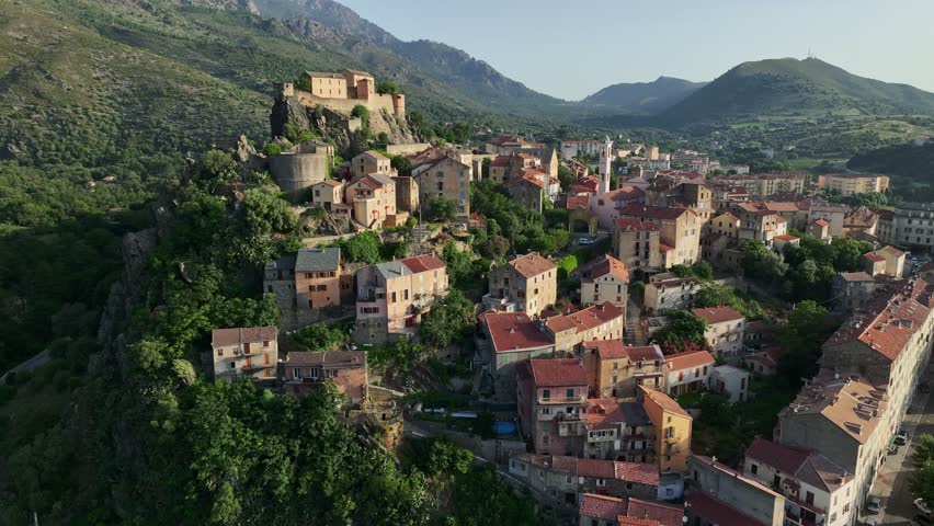 Aerial view of Corte old town, Corsica island. Morning shot of old houses on the mountain in Corte village, Corsica, France Royalty-Free Stock Footage #1106652649