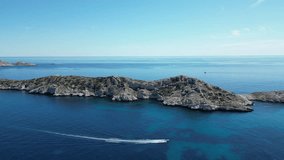 Immerse in Marseille's Calanques with 4K drone footage. Explore the Mediterranean coastline, tranquil sea, remote islands, sailboats, and birds. Perfect for projects needing a touch of natural beauty.