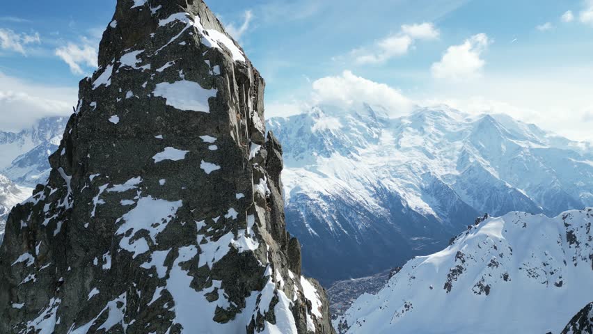 Discover Chamonix's beauty through 4K drone footage. Soar over snow-covered peaks, alpine forests, and rugged terrain. Perfect for showcasing the majestic Mont-Blanc. Ideal for nature  travel project