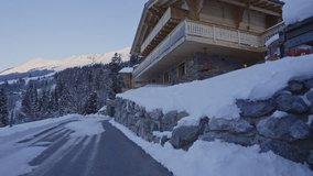 Dolly in of beautiful snow covered chalet in the Swiss countryside - Powered by Shutterstock - Get 15% off with code: PIKWIZARD15