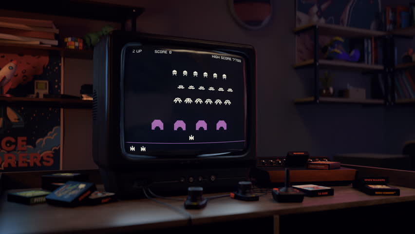 Playing the retro console game in the gaming room from the nineties. Playing the retro video game on the old-school tv set. Playing the retro video game to achieve high score. Digital entertainment. Royalty-Free Stock Footage #1106668997