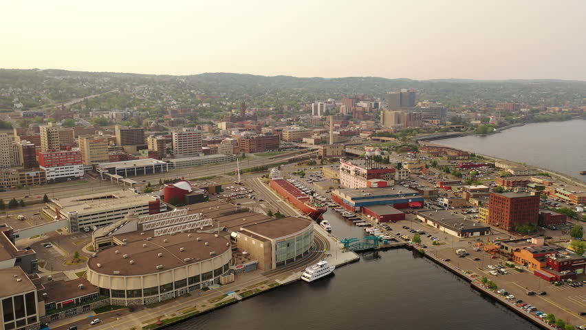 Downtown Duluth, Minnesota, with historic landmarks, modern skyline, lively streets, and scenic waterfront. Aerial view