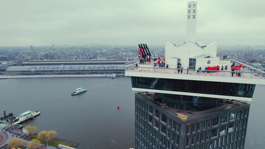 Amsterdam viewpoint with people on it. Background with the city by the water. High quality 4k footage