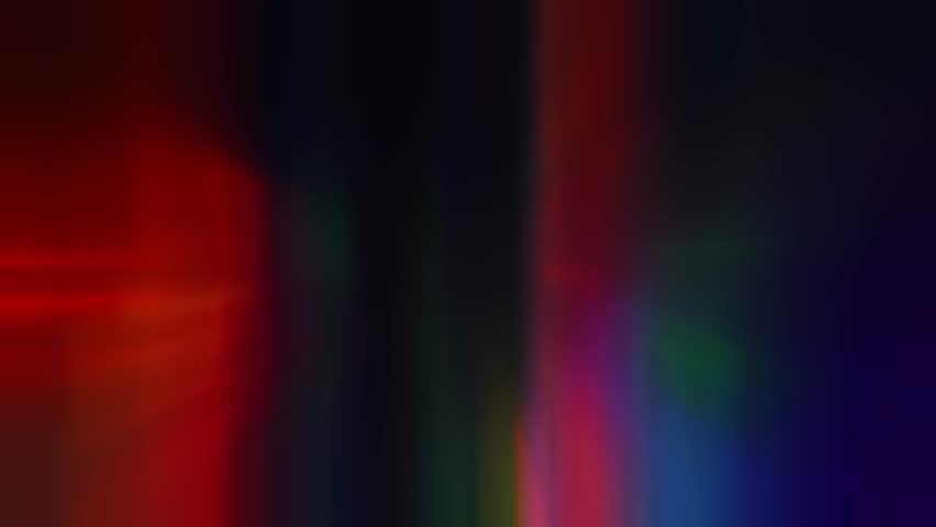 Abstract tunnel of a multicolor spectrum background. Bright rays of neon light and colorful glowing lines moving speed through the dark Royalty-Free Stock Footage #1106679547