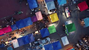 Vibrant Nightlife in Phayao. Aerial Drone View of Bustling People Walking Street and Colorful Night Market. - Powered by Shutterstock - Get 15% off with code: PIKWIZARD15