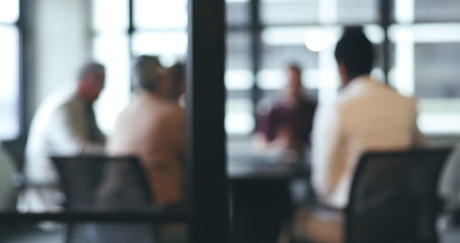 Business people, meeting and corporate discussion against a blurred background at the office. Group of employees in team planning, presentation or training staff for collaboration at the conference