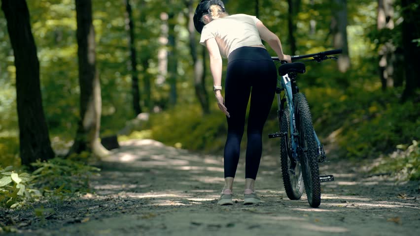 Cyclist Feeling Knee Pain On Exercising Joint Ligament Problem. Muscle Cramp On Leg.Cyclist Having Painful Knee Injury During Cycling Workout Exercise.Legs Trauma Massage Pain Sprain Severe Pain Spasm Royalty-Free Stock Footage #1106685617