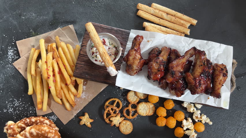 Spicy Homemade Wings with sauce and snack