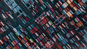 Drone view of shipping containers in a busy port. Logistics, transportation and shipment shot from above. 
Many containers moored in port. Aerial vertical, vertical video background.