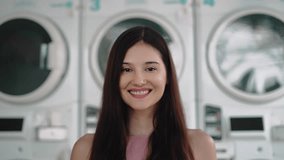 Portrait of Young Woman Looking at Camera on Washing Machines Background. Happy Eyes and Smiling Face of Beautiful Female Person Indoors. Optimism of Successful Adult Girl Standing in Shop Building 4k - Powered by Shutterstock - Get 15% off with code: PIKWIZARD15