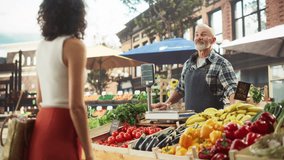 Multiethnic Female Customer Buying Sustainable Natural Tomatoes From a Joyful Senior Farmer on a Sunny Summer Day. Successful Street Vendors Managing a Small Business Farm Stall at an Outdoors Market - Powered by Shutterstock - Get 15% off with code: PIKWIZARD15