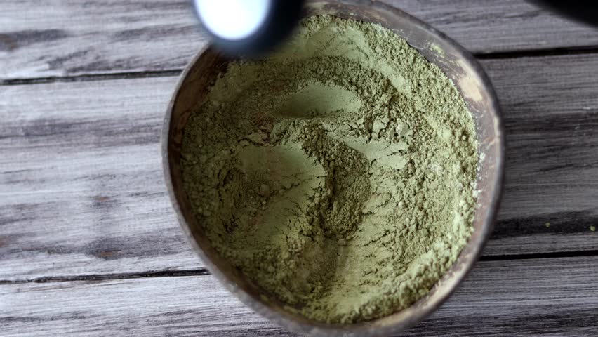 Brewing henna and basma to make a coloring blend of strengthening for hair. Sustainable | Shutterstock HD Video #1106699251