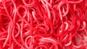 pink spaghetti, rotation in circle. trendy pink dishes, Turning. selective focus.  barbie pasta