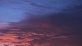 A timelapse video captures the mesmerizing beauty of the sunrise sky adorned with majestic clouds, painting the horizon with vibrant hues and casting a spellbinding spectacle that captivates the soul.