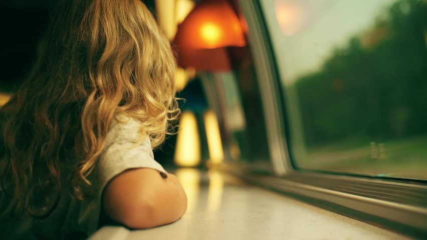 Happy little blonde girl looks through the window while traveling to Paris by French train Royalty-Free Stock Footage #1106701463