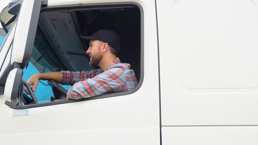 Trucker Preparing For Trip. Caucasian Men Talking on CB Radio. Truck Driver Job Royalty-Free Stock Footage #1106701951