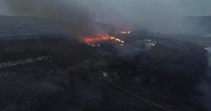 aerial video of the start of a forest fire at nightfall. Ecology concept
