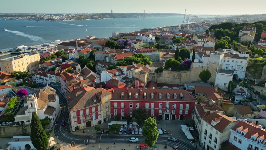 Aerial view of Alfama district in Lisbon. Houses and streets of the oldest quarter of Lisbon - Alfama and view to river Tejo