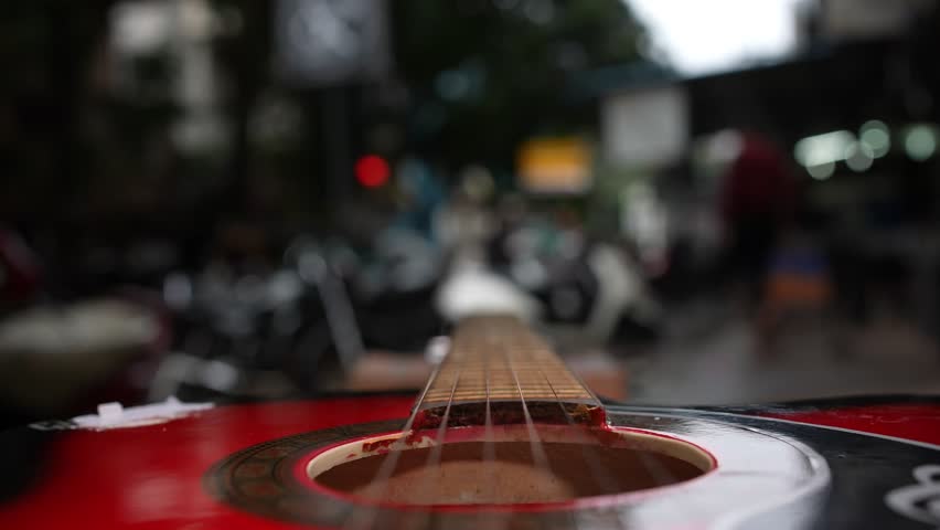 100 fps Guitar playing with blurred background in roadside, for slow motion 