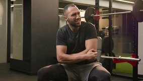 African American man guy in gym doing sport exercise with dumb-bell curl biceps workout sportsman athlete lifting up heavy dumbbell weights feel sharp pain in joint hand elbow painful injury trauma - Powered by Shutterstock - Get 15% off with code: PIKWIZARD15
