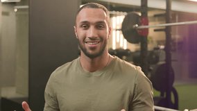 Sport vlogger male influencer streaming online in social media fitness trainer African American ethnic sport man guy athletic sportsman athlete talking at camera in gym talk speak video call workout - Powered by Shutterstock - Get 15% off with code: PIKWIZARD15