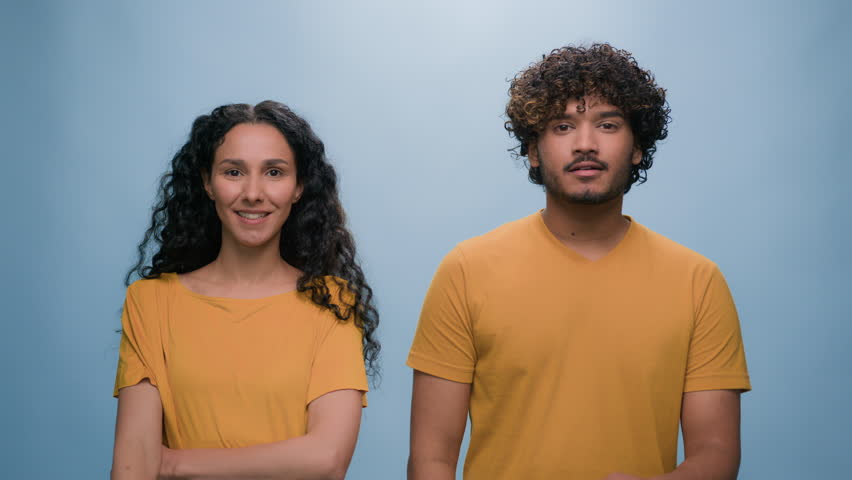 Portrait in studio blue background Hispanic boyfriend girlfriend thoughtful think idea problem solution pondering multiracial diverse couple pensive two friends family man woman decision thinking Royalty-Free Stock Footage #1106705061