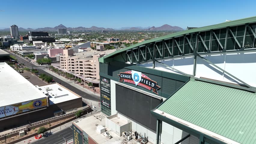 Phoenix , AZ , United States - 06 28 2023: Chase Field is a MLB stadium in downtown Phoenix, AZ. Home to the Arizona Diamondbacks. Aerial establishing shot.