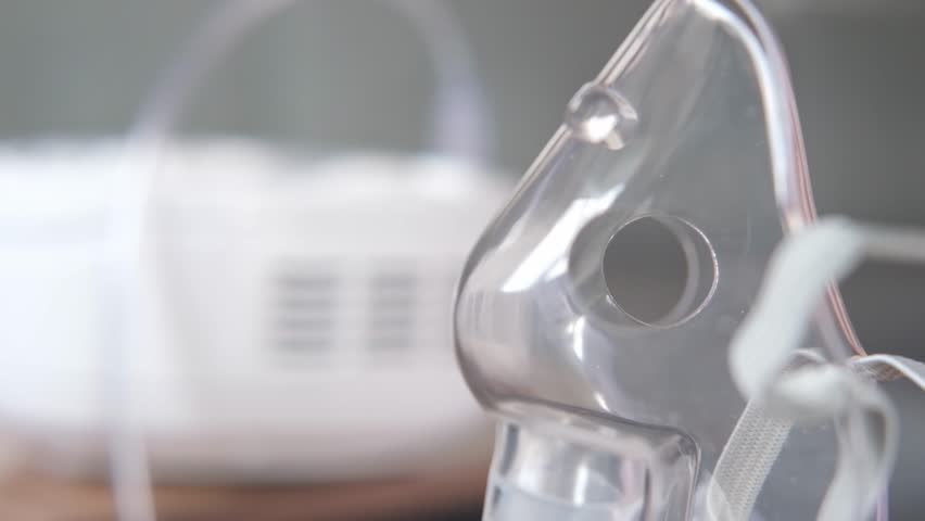 inhaler mask closeup with steam. Medical product. Cold treatment Royalty-Free Stock Footage #1106711309