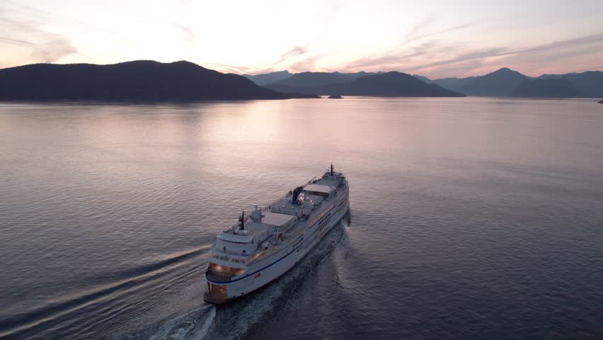 Car ferry on the ocean with a beautiful ocean and mountain view at sunset, Howe Sound, BC, sea, aerial drone footage. 4K 24FPS p Royalty-Free Stock Footage #1106716785