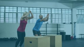 Animation of like text and thumb up symbols over caucasian man and woman jumping on boxes in gym. Social media, internet, networking, fitness and healthy lifestyle concept digitally generated video.