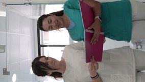 Nurses walking in the hospital.Vertical Video