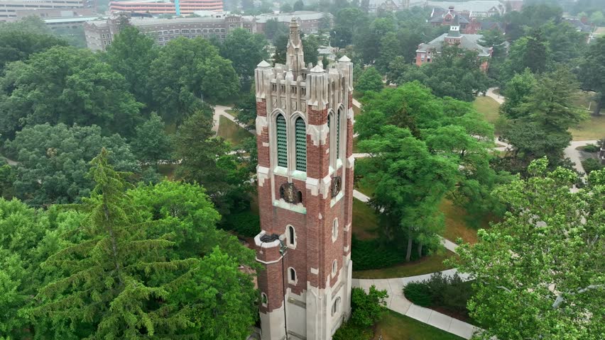 Beaumont Tower on Michigan State University Campus. Aerial orbit during summer day.