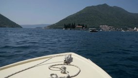 Video from the boat. The Catholic monastery of St. George's Islands, located on a small island in the Bay of Kotor near the city of Perast. Travel concept to Montenegro.