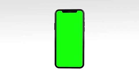 Green Screen Display Mobile Phone  Opens and Zoom In on a White Background for Watching and Paste Background e Business Blog or Gaming App. Copy 3d Smart Phone with Clear Chroma Key for Mockup. : vidéo de stock