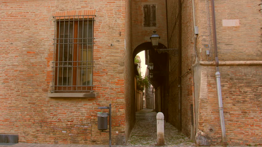 Narrow Alleyway Through Buildings In The Old Town Of Forli In Emilia-Romagna, Italy