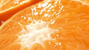 Macro video, a group of oranges slices is captured in exquisite detail. With a probe lens, each vibrant half reveals intricate patterns, textures, and juicy segments. Fruit concept. Orange background
 - Powered by Shutterstock - Get 15% off with code: PIKWIZARD15