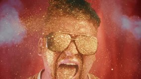 Brave man sprinkles himself with sparkle particles.Glamour luxury video, shine face, open mouth.Rich view portrait male person in sunglasses, pouring on face gold glitter in super slow motion 1000fps