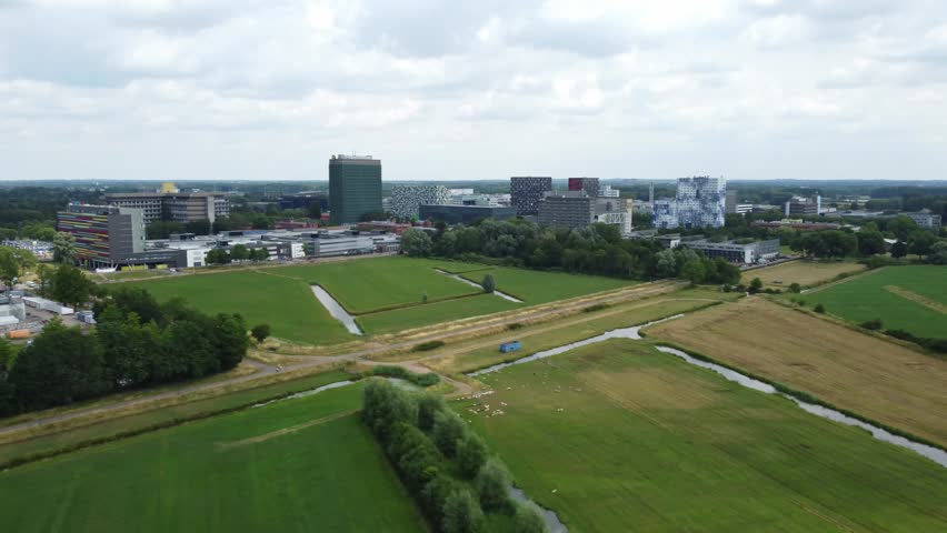 Panning aerial view over the green surroundings of the Utrecht Science Park.