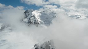 Mont Blanc, Chamonix, France. Time Lapse of Clouds Covering Snow Capped Peaks of French Alps - Powered by Shutterstock - Get 15% off with code: PIKWIZARD15