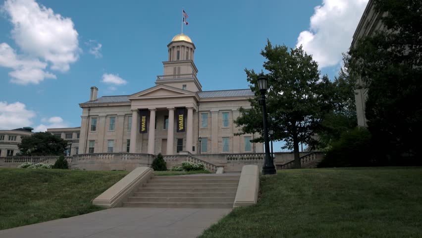 Old Capitol building on the campus of the University of Iowa in Iowa City, Iowa with stable video showing steps.