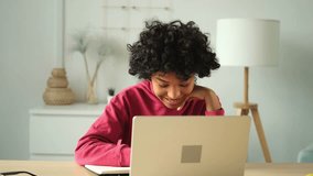 African american girl using laptop computer having video chat at home. Young woman having virtual meeting online chat video call conference. Work learning from home, remote teacher