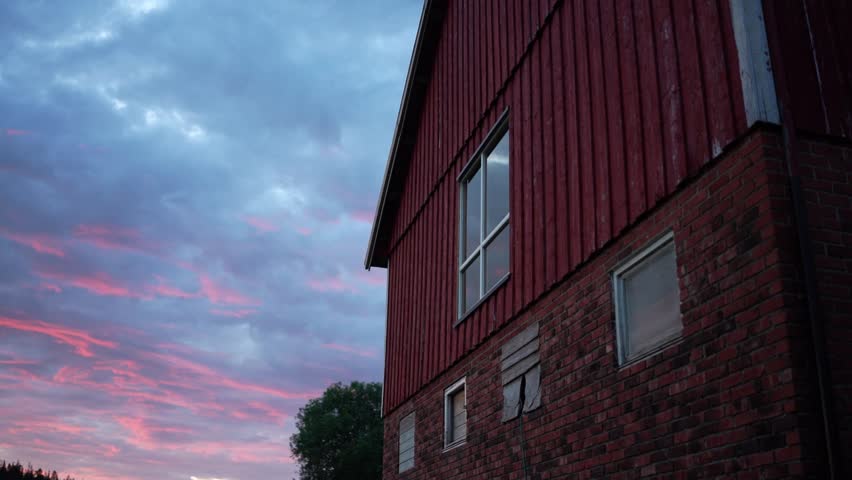 Scenic Clouds On Sunset Over Vintage Wooden Farm House. Timelapse