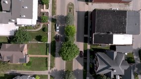 Downtown Geneseo, Illinois with drone video overhead looking down and moving forward.