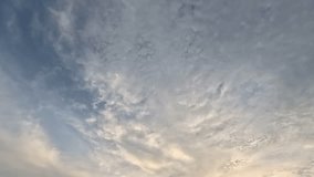Sunset background or texture with clouds. Beautiful landscape with sky, clouds and sunrise a panoramic view. Time lapse.