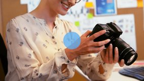 Animation of network of digital icons over caucasian female photographer holding digital camera. Global networking and business technology concept - Powered by Shutterstock - Get 15% off with code: PIKWIZARD15