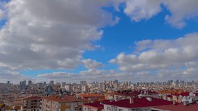Timelapse: fast moving white clouds in the blue sky over typical turkish apartment, residential buildings in Istanbul - afternoon, daylight. Oriental, cityscape, architecture and time lapse concept - Powered by Shutterstock - Get 15% off with code: PIKWIZARD15