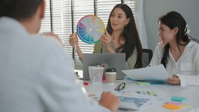 Product design team choosing colors to make product package inside office, concept brainstorming, coordination, teamwork
 - Powered by Shutterstock - Get 15% off with code: PIKWIZARD15