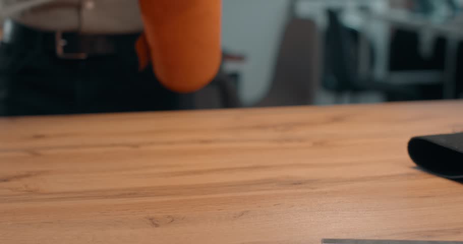 only natural real genuine leather for your handmade items Slow motion. Shoemaker examining a piece of leather in workshop, checking the quality from the touch and softness of texture.