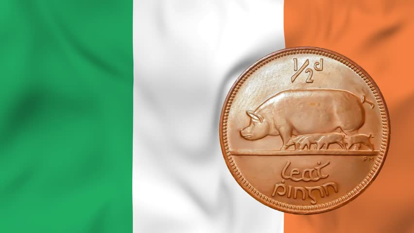 Waving flag of Ireland and rotating reverse of old 12 penny coin. 3d animation in 4k resolution video.