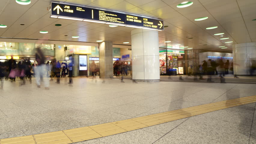 Time lapse footage with pan left motion of anonymous rush hour commuters at Shinjuku Station in Tokyo, Japan | Shutterstock HD Video #11067767